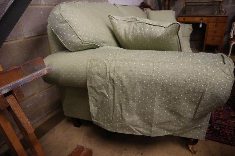 A modern Victorian-style two-seater settee, upholstered in patterned green fabric, width 220cm depth 98cm height 92cm